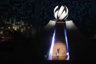 <p>TOKYO, JAPAN - JULY 23: Naomi Osaka of Team Japan carries the Olympic torch towards the Olympic cauldron during the Opening Ceremony of the Tokyo 2020 Olympic Games at Olympic Stadium on July 23, 2021 in Tokyo, Japan. (Photo by Laurence Griffiths/Getty Images)</p> 