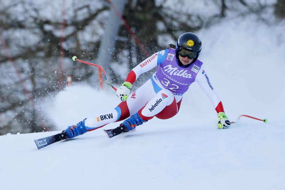 Switzerland's Jasmina Suter speeds down the course during an alpine ski, women's World Cup super-G race in Zauchensee, Austria, Sunday, Jan. 16, 2022. (AP Photo/Giovanni Maria Pizzato)