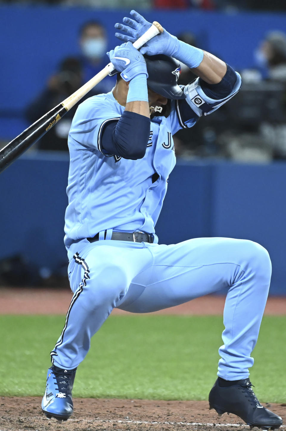 Toronto Blue Jays' Lourdes Gurriel Jr ducks from a high inside pitch from Houston Astros' Luis Garcia in the sixth inning of a baseball game in Toronto, Saturday, April 30, 2022. (Jon Blacker/The Canadian Press via AP)