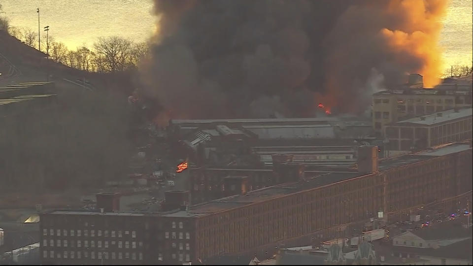 Smoke fills the sky from a fire in Elizabeth, NJ. Firefighters were battling a three-alarm fire at a New Jersey industrial park early Friday, a city official said. (WABC via AP)