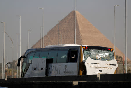 FILE PHOTO: A damaged bus is seen at the site of a blast near a new museum being built close to the Giza pyramids in Cairo, Egypt, May 19, 2019. REUTERS/Amr Abdallah Dalsh/File Photo