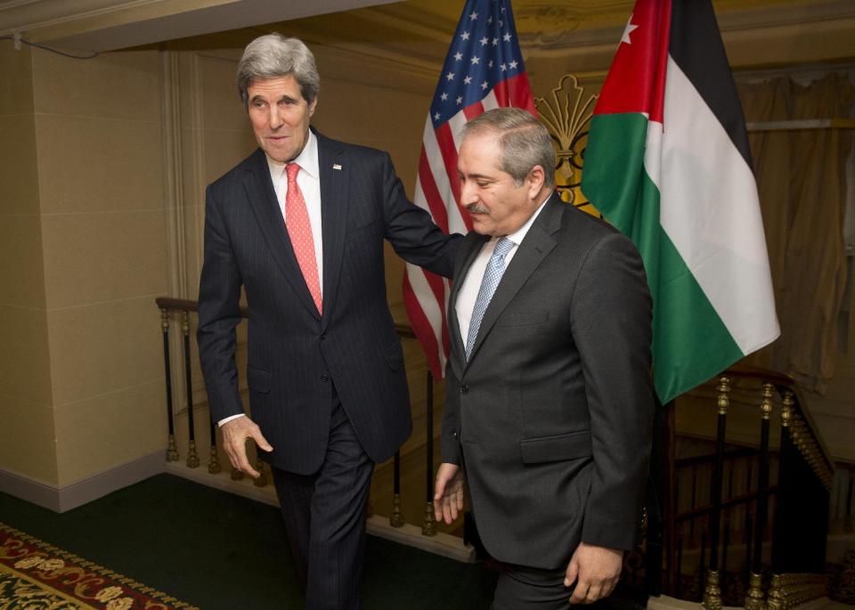 US Secretary of State John Kerry, left, meets with Jordanian Foreign Minister Nasser Judeh about the ongoing humanitarian crisis and violence in Syria on Wednesday, Feb. 19, 2014, in Paris. (AP Photo/ Evan Vucci)