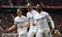 Britain Football Soccer - Manchester United v Swansea City - Premier League - Old Trafford - 30/4/17 Swansea City's Gylfi Sigurdsson celebrates with Martin Olsson and Tom Carroll after scoring their first goal Action Images via Reuters / Jason Cairnduff Livepic
