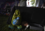 A statue of Mother Earth sits at the front of an altar used by a Colombian shaman, healer and traditional medicine man who leads the Hummingbird Church ayahuasca ceremonies, on Sunday, Oct. 16, 2022, in Hildale, Utah. Like many groups using psychedelics as sacraments, Hummingbird functioned underground for many years, hosting word of mouth ceremonies. But in Feb. 2021, they decided to go public. (AP Photo/Jessie Wardarski)