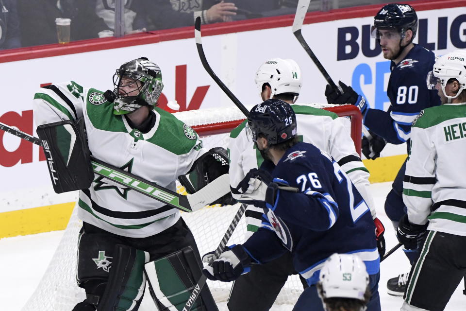 Dallas Stars' goaltender Scott Wedgewood (41) makes a save on Winnipeg Jets' Blake Wheeler (26) during the first period of an NHL hockey game, Tuesday, Nov. 8, 2022 in Winnipeg, Manitoba. (Fred Greenslade/The Canadian Press via AP)