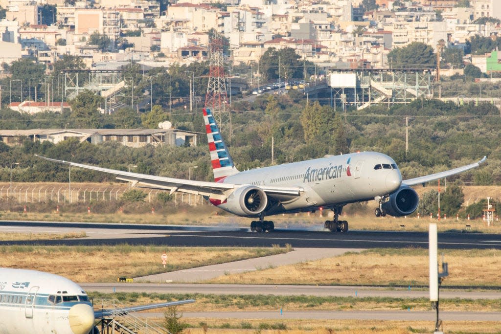 American Airlines Boeing 787 Dreamliner passenger aircraft as seen flying, landing, touching down and taxiing at Athens International Airport ATH Eleftherios Venizelos in the Greek capital.