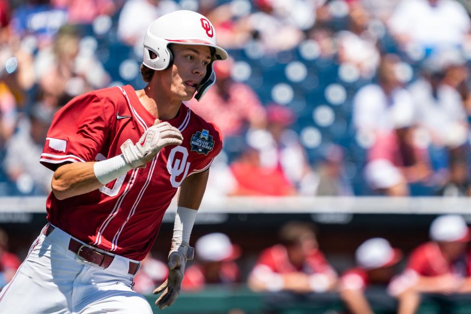 OU shortstop Peyton Graham (20) runs after hitting a double against Texas A&M on June 22.