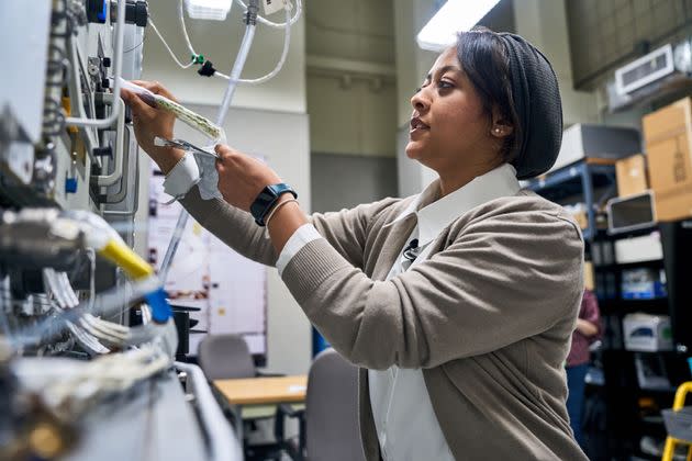 Astronaut Rayyanah Barnawi prepares food in 2023.