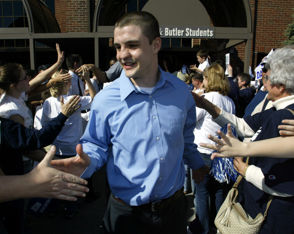 Butler guard Brandon Miller works his way through the crowd of well-wisher outside Hinkle Fieldhouse as he makes his way to the team bus in 2003. (AP)