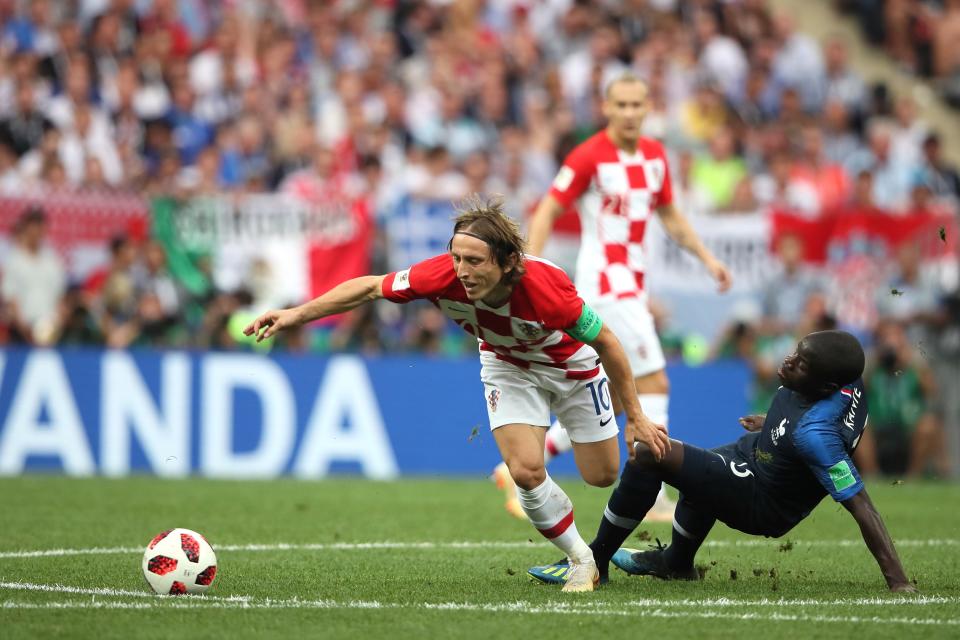 <p>Luka Modric of Croatia is challenged by Ngolo Kante of France. (Photo by Matthew Ashton – AMA/Getty Images) </p>