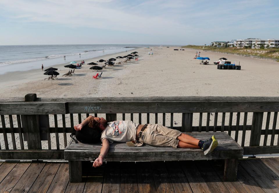 A visitor relaxes on the Tybee Island Pier.