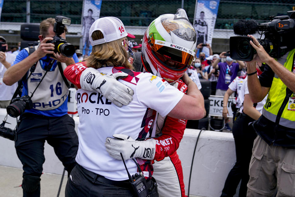 Simona De Silvestro of Switzerland hugs a member of her crew after making the field during the last row qualifications for the Indianapolis 500 auto race at Indianapolis Motor Speedway in Indianapolis, Sunday, May 23, 2021. (AP Photo/Michael Conroy)