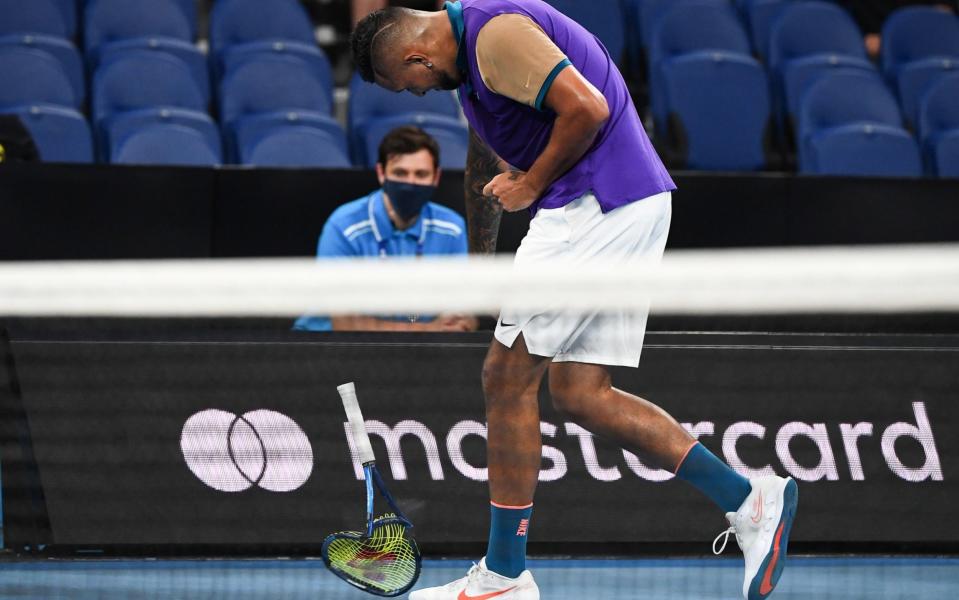 Australia's Nick Kyrgios throws his racquet as he plays against France's Ugo Humbert during their men's singles match on day three of the Australian Open tennis tournament in Melbourne on February 10, 2021. - AFP