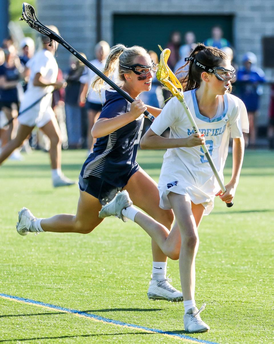 Cohasset's Maddie Miller chases for the ballduring the Division 3 state title game against Medfield at Babson College in Wellesley on Tuesday, June 21, 2022.