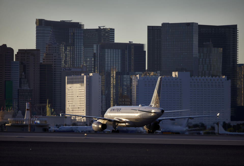 FILE - In this May 16, 2016, photo, a plane taxis toward the terminal after landing at McCarran International Airport in Las Vegas. Federal and airport authorities said Friday, Nov. 9, 2018, they are investigating why an air traffic controller became incapacitated and went silent while working a night shift alone in the tower at busy McCarran International Airport. Five inbound aircraft remained airborne during the incident, and aircraft on the ground held positions or communicated between themselves to maintain safety while moving, the FAA said. (AP Photo/John Locher, File)