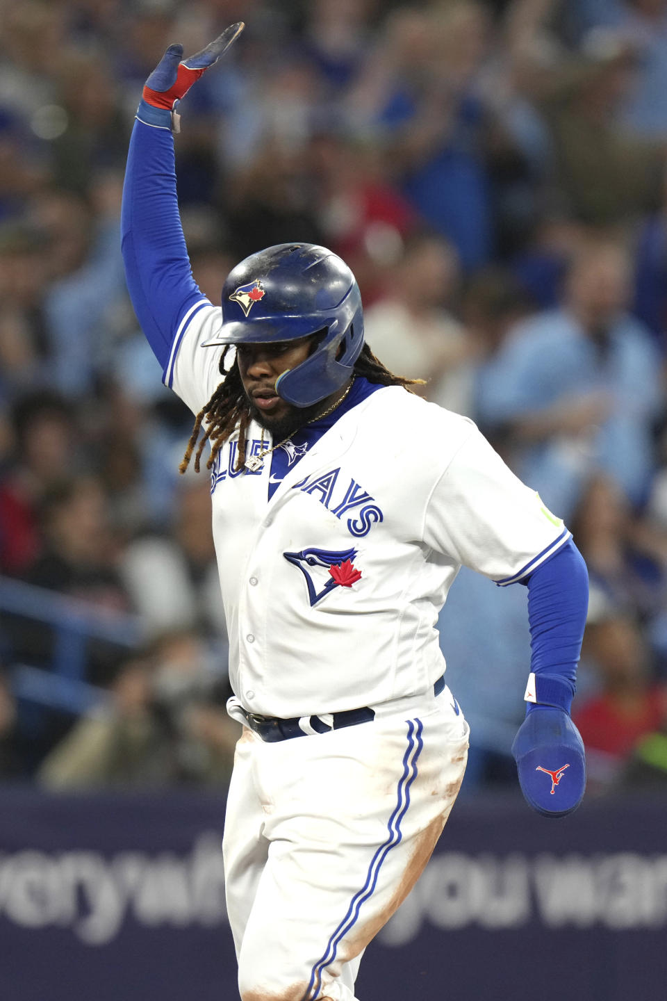 Toronto Blue Jays' Vladimir Guerrero Jr. celebrates as he crosses home plate to score against the Tampa Bay Rays during the sixth inning of a baseball game Friday, Sept. 29, 2023, in Toronto. (Chris Young/The Canadian Press via AP)