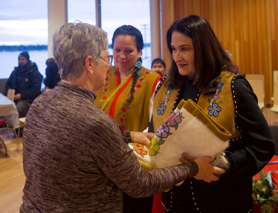 Vuntut Gwitchin First Nation Chief Pauline Frost, right, is sworn into office in Old Crow, Yukon, Jan. 11, 2023. 