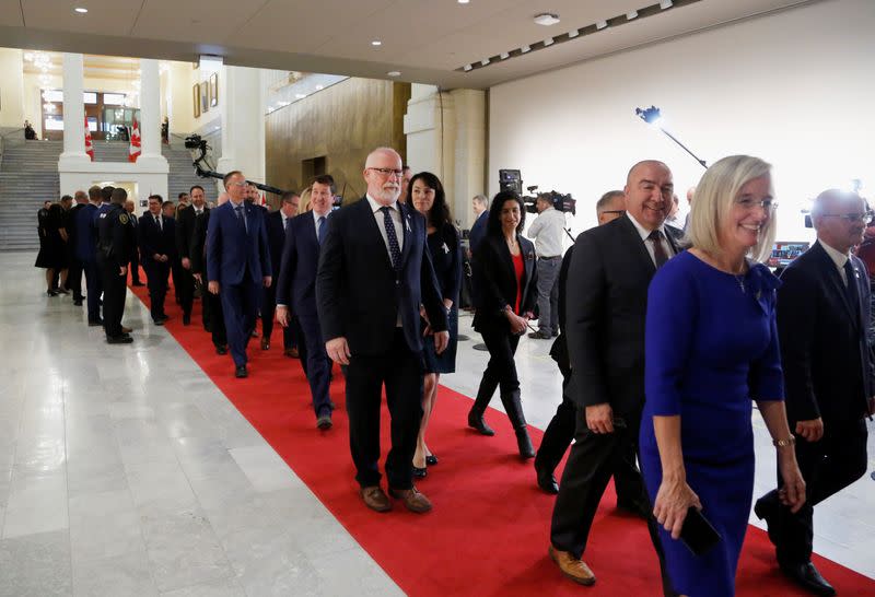 Members of Parliament arrive at the Senate before the speech from the throne in Ottawa