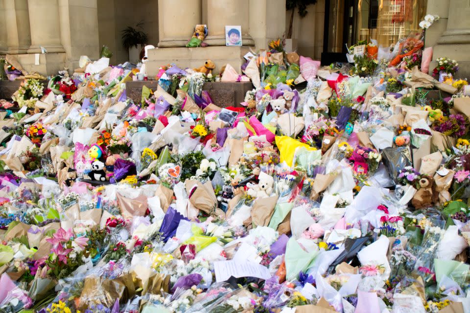 Melbourne residents have laid floral tributes at the scene of the Bourke St car rampage.
