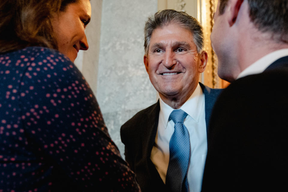 Sen. Joe Manchin chats with his staffers on Capitol Hill in Washington on Aug. 6, 2022. / Credit: Shuran Huang for The Washington Post via Getty Images