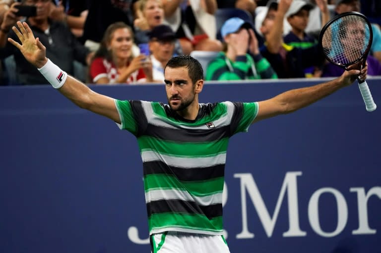 Instant classic: Marin Cilic celebrates after his five-set, four-hour US Open victory over Alex de Minaur on Louis Armstrong Stadium