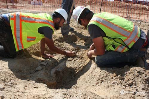 Joe Sertich, at left, works to excavate the fossilized bones in Thornton, Colorado. (Photo: City of Thornton)