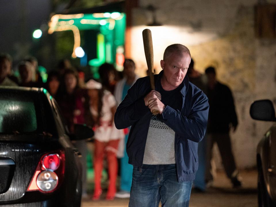 Anthony Michael Hall holding a bat