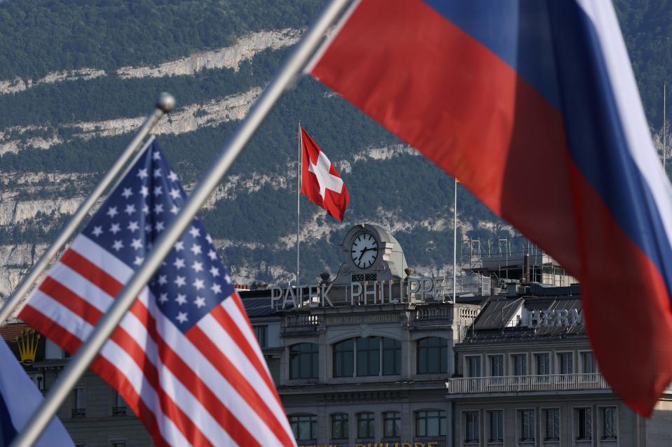 A Swiss flag flies behind Russian and American flags in Geneva, Switzerland, prior to a meeting between President Joe Biden and Russian President Vladimir Putin on June 15, 2021.