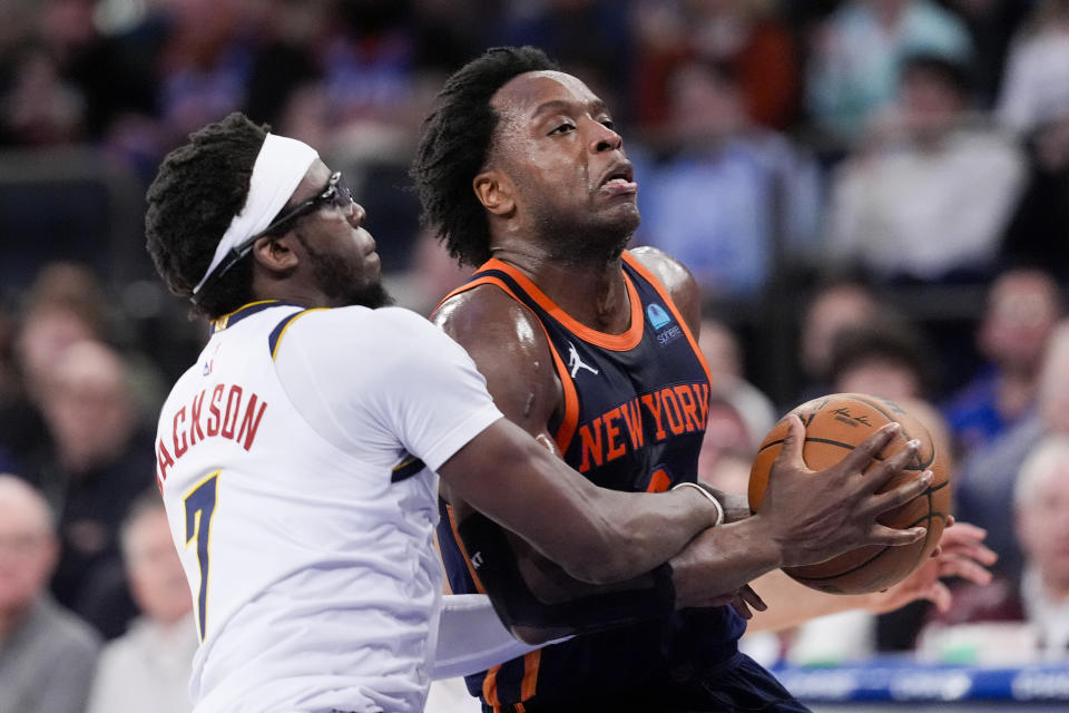 New York Knicks forward OG Anunoby, right, drives to the basket against Denver Nuggets guard Reggie Jackson (7) in the second half of an NBA basketball game, Thursday, Jan. 25, 2024, at Madison Square Garden in New York. (AP Photo/Mary Altaffer)