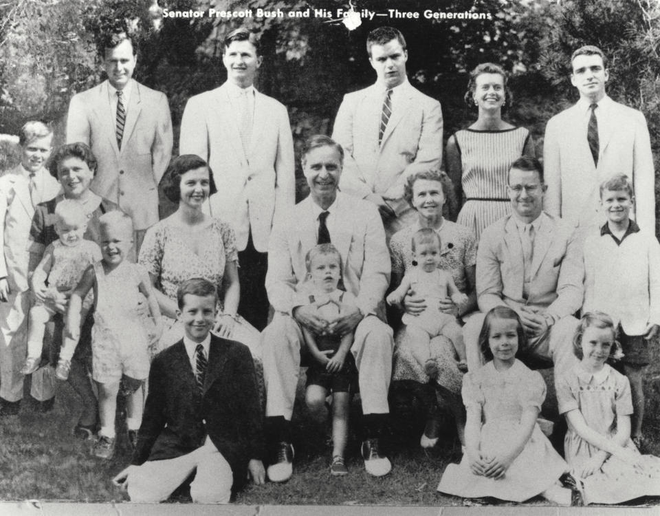 This undated and unlocated picture shows Senator Prescott Bush (C) posing with son George Herbert Walker Bush on the left. (AFP/Getty Images)  -- Father of George H.W. Bush, Prescott Bush Jr., Nancy Walker Bush Ellis, Jonathan Bush, William H.T. Bush