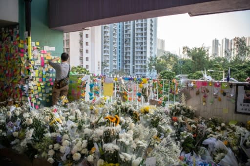 A makeshift memorial overflows with flowers at the car park where Alex Chow fell during a recent protest