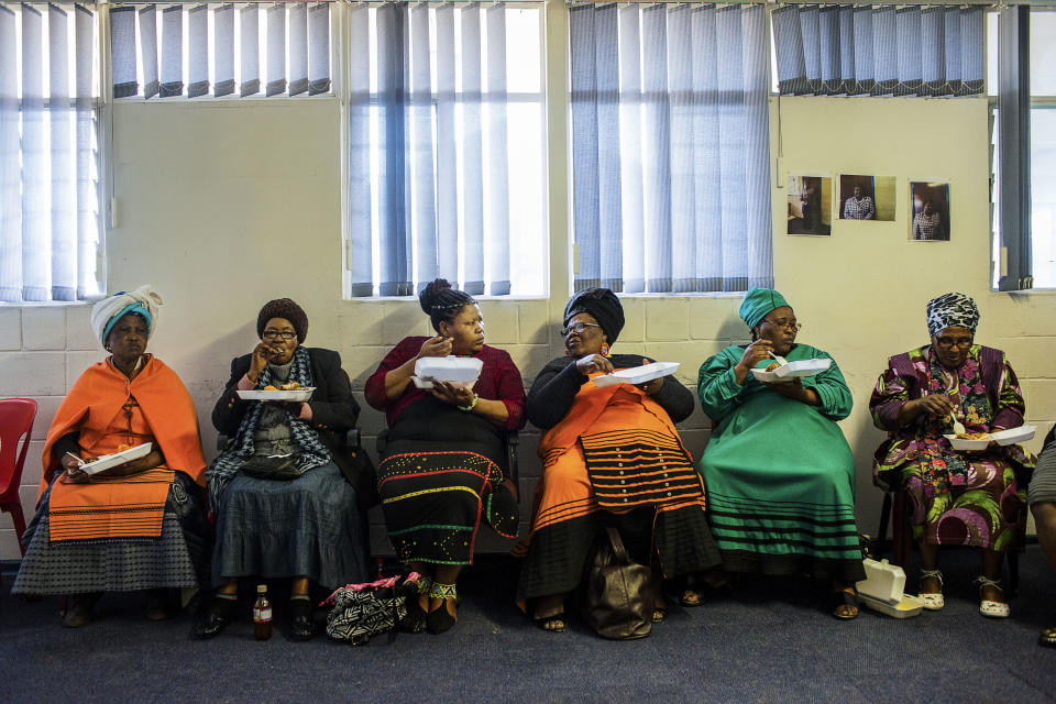 <p>Some women during a political meeting organized in the township of Khayelitsha, one of the poorest areas of Cape Town. During the meeting, free food and alcohol is offered to all present. (Photograph by Silvia Landi) </p>