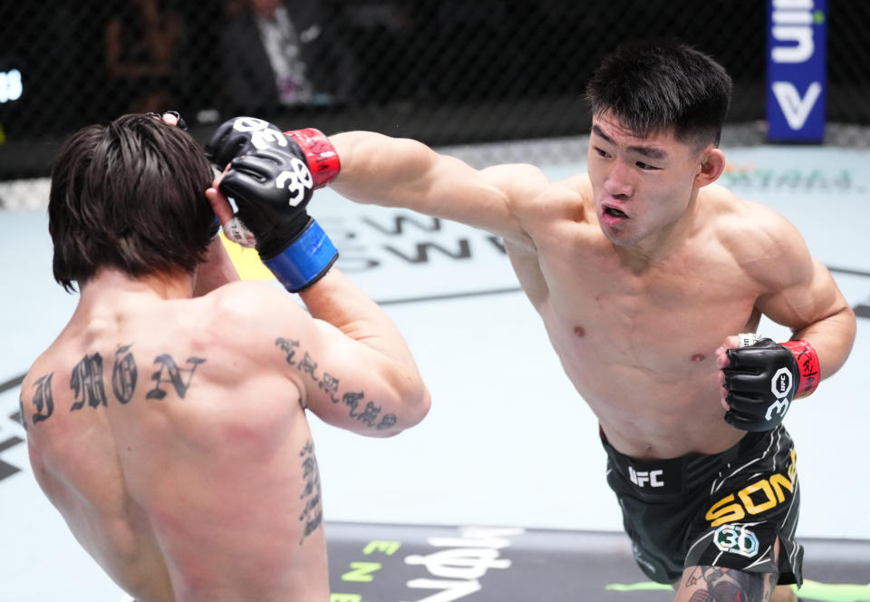 LAS VEGAS, NEVADA – APRIL 29: (R-L) Song Yadong of China punches Ricky Simon in a bantamweight fight during the UFC Fight Night event at UFC APEX on April 29, 2023 in Las Vegas, Nevada. (Photo by Jeff Bottari/Zuffa LLC via Getty Images)