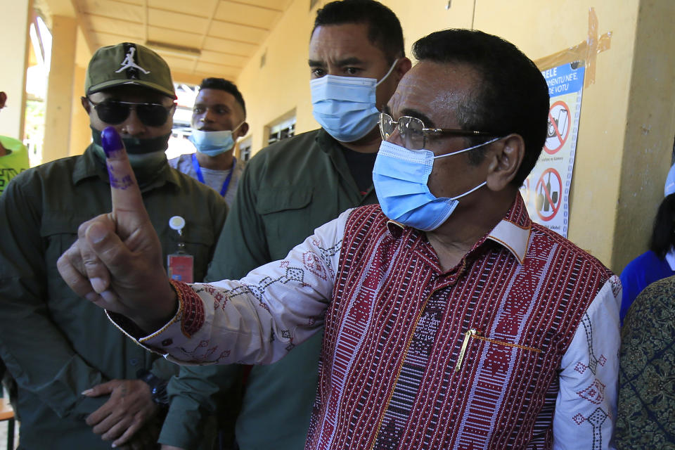 FILE - Incumbent East Timorese President Francisco "Lu Olo" Guterres shows his inked finger after casting his ballot at a polling station during the election in Dili, East Timor on March 19, 2022. Voters in East Timor are choosing a president in a runoff Tuesday, April 19, 2022 between former independence fighters who’ve blamed each other for years of political paralysis. (AP Photo/Lorenio Do Rosario Pereira, File)