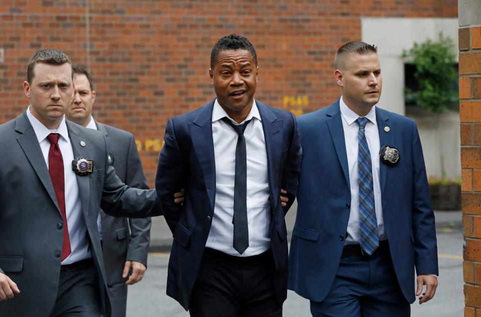 Cuba Gooding Jr. is cuffed and taken by detectives from New York police precinct on June 13, 2019, after he was arrested and charged with forcible touching after a woman accused the actor of groping her at a New York City bar.