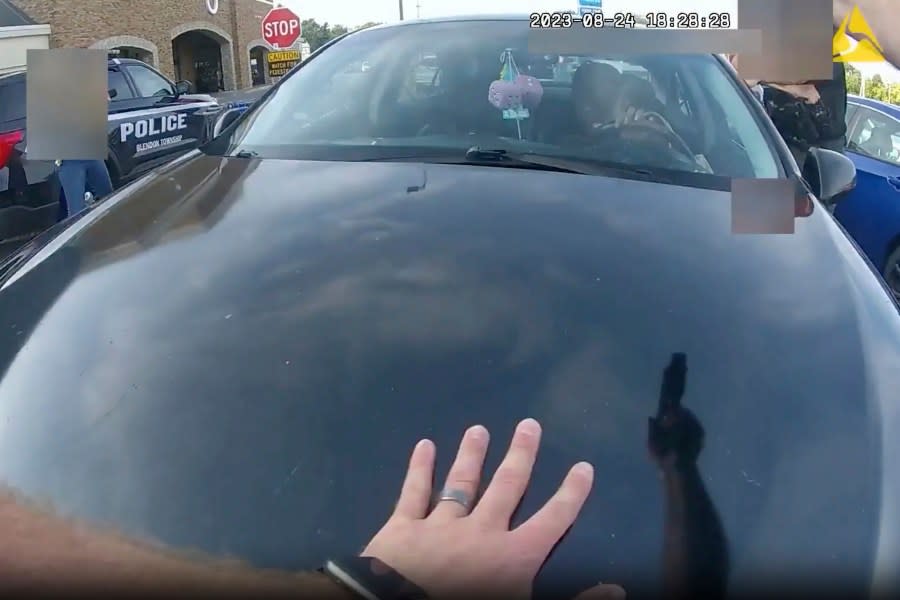 This image from bodycam video released by the Blendon Township Police on Friday, Sept. 1, 2023, shows an officer pointing his gun at Ta’Kiya Young moments before shooting her through the windshield outside a grocery store in Blendon Township, Ohio, a suburb of Columbus, on Aug. 24. (Blendon Township Police via AP)