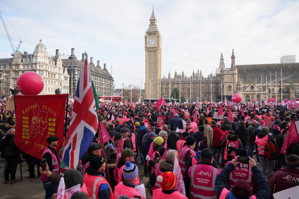 Members of the Communication Workers Union (CWU) hold a rally in Parliament Square (PA)