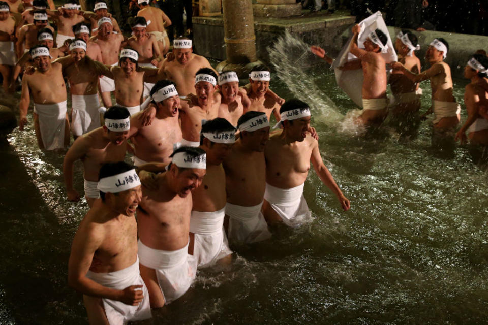 The men wear only loin cloths in freezing cold temperatures. (Getty Images)