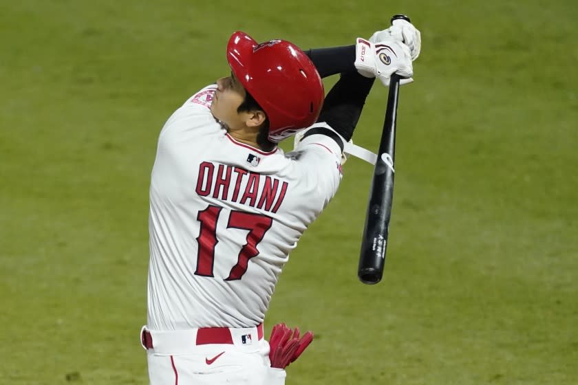 Los Angeles Angels designated hitter Shohei Ohtani swings a strike during the fifth inning of a baseball game against the Texas Rangers, Saturday, Sept. 19, 2020, in Anaheim, Calif. (AP Photo/Ashley Landis)