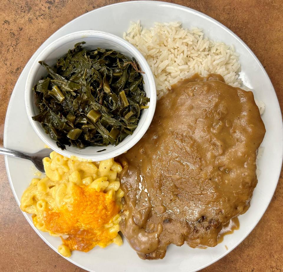 Pork chops smothered in rich gravy, mac and cheese, collard greens and rice are among the soul food specialties on the menu at Chef's Kitchen in Cocoa.