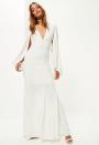 <p><a rel="nofollow noopener" href="https://www.missguided.co.uk/bridal-white-v-plunge-cape-sleeve-maxi-dress" target="_blank" data-ylk="slk:Missguided, £90;elm:context_link;itc:0;sec:content-canvas" class="link "><i>Missguided, £90</i></a> </p>