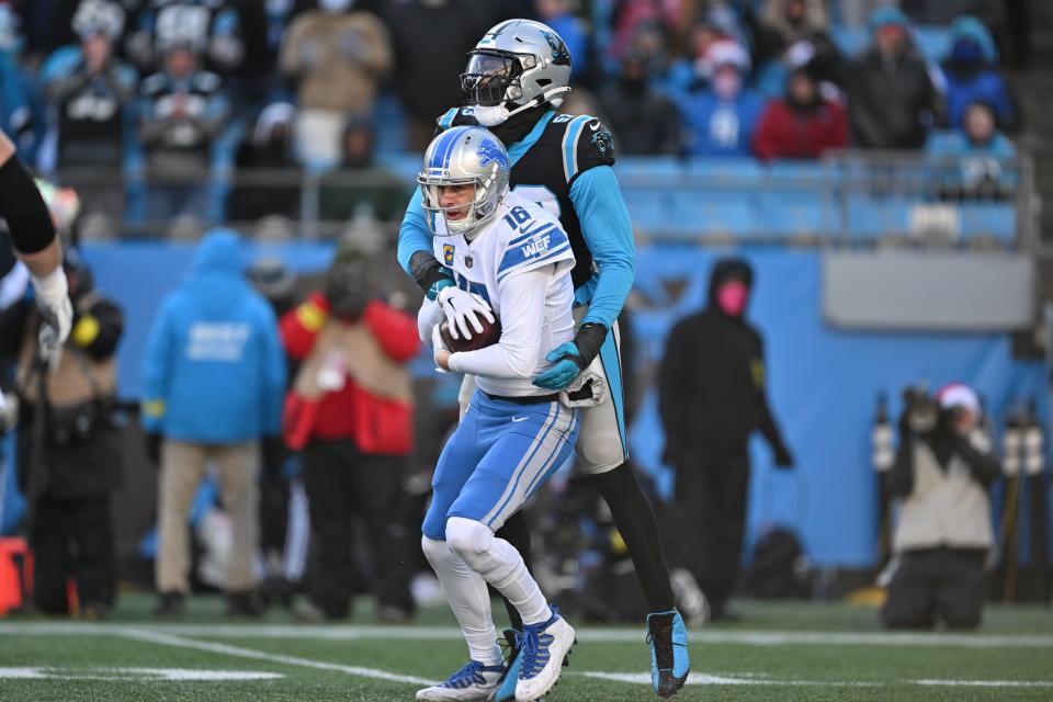 Brian Burns of the Carolina Panthers sacks Jared Goff of the Detroit Lions during the third quarter at Bank of America Stadium on Dec. 24, 2022 in Charlotte, North Carolina.
