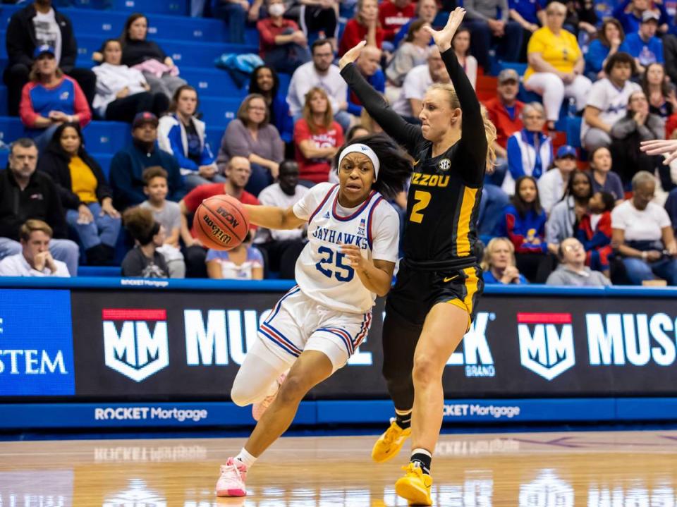 Kansas guard Chandler Prater (25) attempts to drive around Missouri guard Sara-Rose Smith (2) during the second round of the Women’s NIT game between the Kansas Jayhawks and Missouri Tigers on Saturday March 20, 2023 at Allen Field house in Lawrence, Kansas.