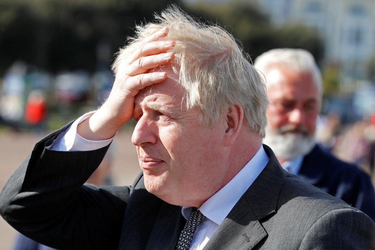 Britain's Prime Minister Boris Johnson gestures as he campaigns in Llandudno, north Wales on April 26, 2021, ahead of the May 6 Welsh elections. (Photo by PHIL NOBLE / POOL / AFP) (Photo by PHIL NOBLE/POOL/AFP via Getty Images)