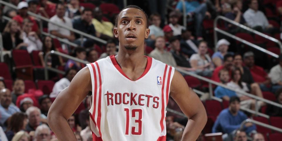 Ish Smith stands with his hands on his hips during a Rockets game in 2010.