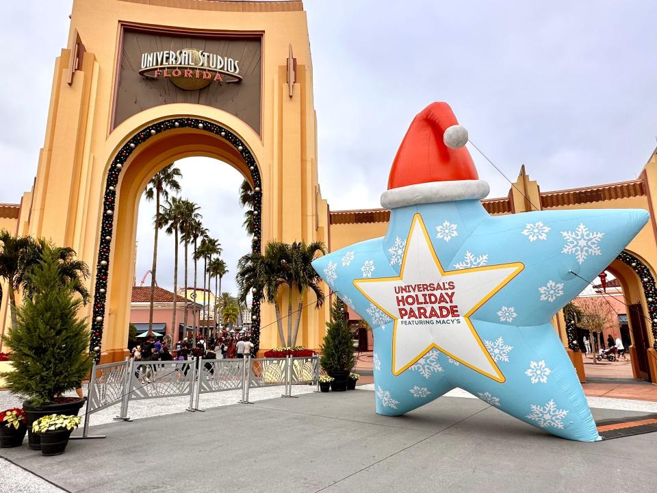 entrance to universal studios florida decorated for Christmas and the holiday parade