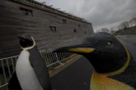 Life-size replica's of penguins are seen outside a full scale replica of Noah's Ark which has opened its doors in Doredrecth, Netherlands, Monday Dec. 10, 2012, after receiving permission to host up to 3,000 visitors per day. (AP Photo/Peter Dejong)