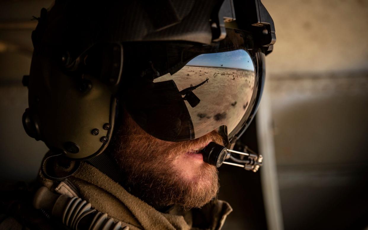 An RAF gunner provides cover from a Chinook carrying French troops in the Sahel -  Simon Townsley