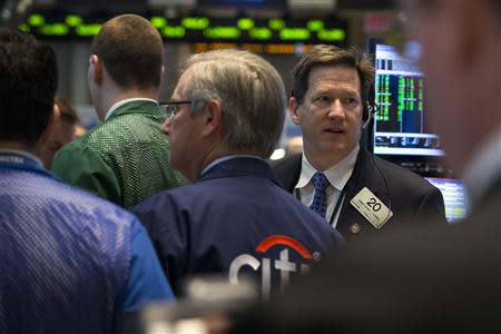 Traders work on the floor of the New York Stock Exchange March 24, 2014. REUTERS/Brendan McDermid