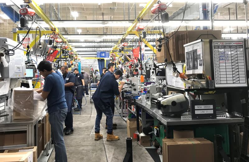 FILE PHOTO: Hydraulic valve manufacturer HydraForce Inc. employees work in the firmÕs plant in Lincolnshire